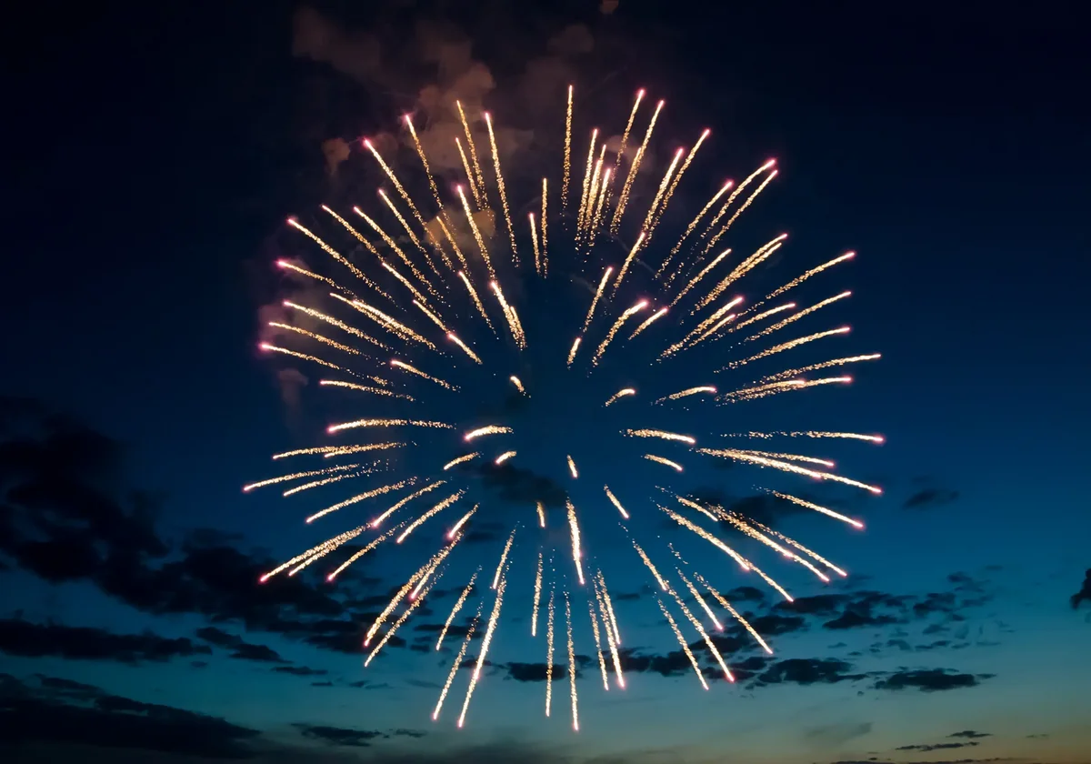 Fireworks on the background of blue sky